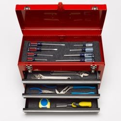 A well-organized toolbox with various wrenches and tools, symbolizing preparedness for car battery terminal replacement