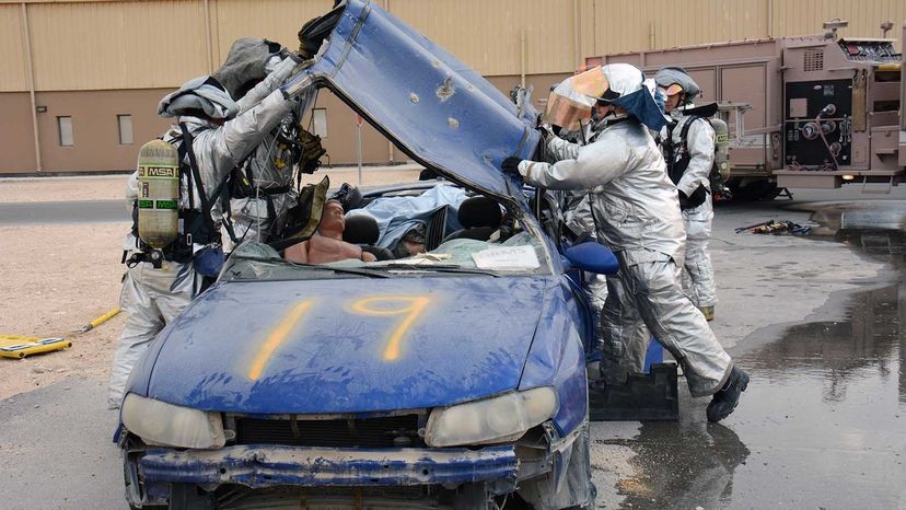 Jaws of Life cutters, a powerful car rescue tool, demonstrated cutting through a car roof during an emergency vehicle extrication exercise.