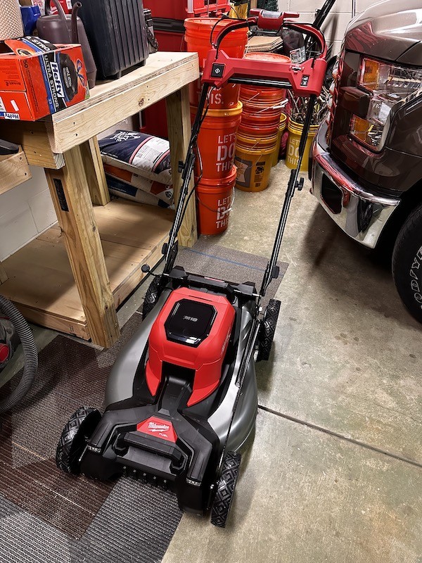 Milwaukee M18 cordless lawn mower box, indicating initial purchase and anticipation for using M18 fuel lawn care tools.