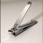 Close-up of stainless steel nail clippers, essential for trimming fingernails and toenails evenly.