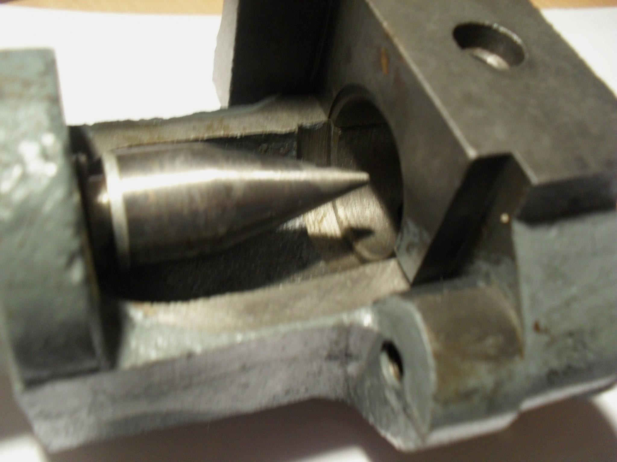 Close-up of a flaring tool with various attachments.