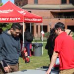 Milwaukee Tool employee interacting with students at Tool-A-Thon.