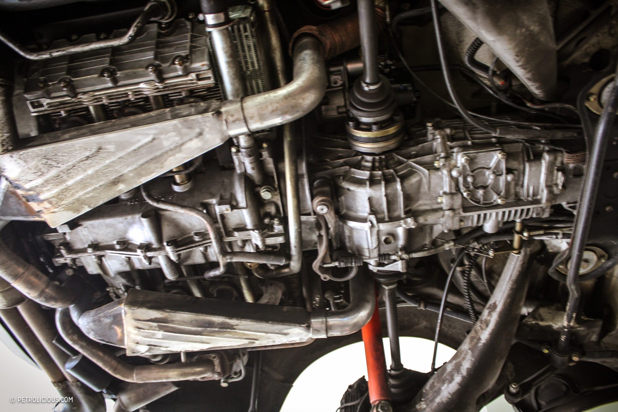 alt text: Dry ice blasting equipment setup with a technician preparing to clean a car part.