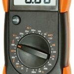 Klein MM100 Multimeter being used to test a car battery.